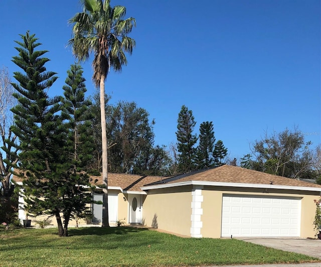 2726 Knoll St E, Palm Harbor, FL 34683 - single story home featuring a garage, a front yard, stucco siding, and concrete driveway