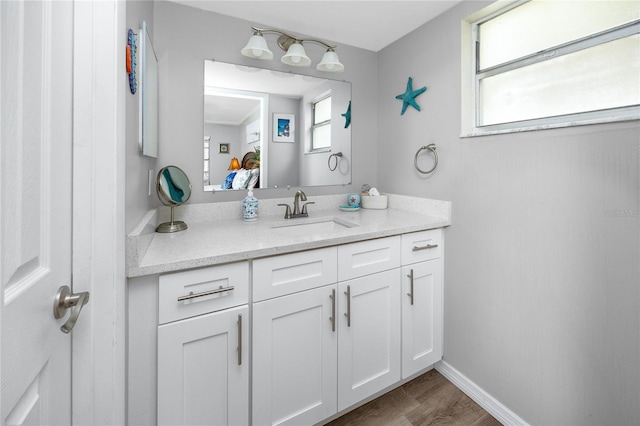 2726 Knoll St E, Palm Harbor, FL 34683 - bathroom featuring vanity and wood finished floors