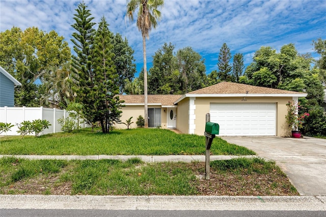 2726 Knoll St E, Palm Harbor, FL 34683 - ranch-style home with a garage, stucco siding, and concrete driveway