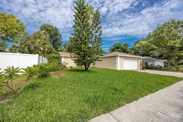 2726 Knoll St E, Palm Harbor, FL 34683 - view of yard featuring driveway and a garage