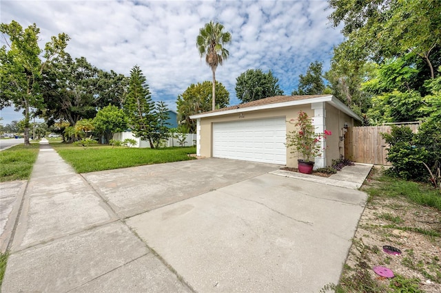 2726 Knoll St E, Palm Harbor, FL 34683 - garage featuring concrete driveway