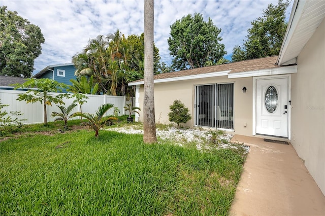 2726 Knoll St E, Palm Harbor, FL 34683 - property entrance with stucco siding and roof with shingles