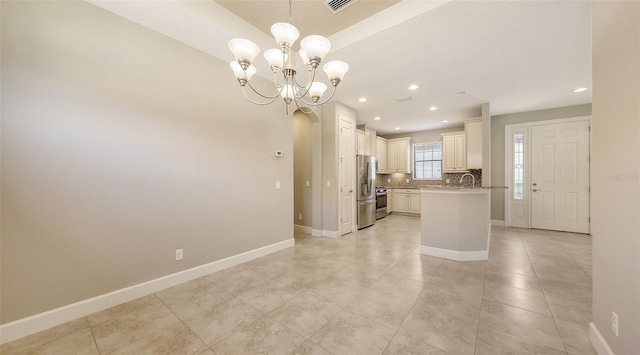 kitchen featuring appliances with stainless steel finishes, tasteful backsplash, a chandelier, recessed lighting, and baseboards