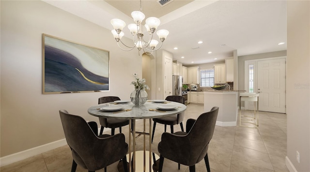 dining area featuring a chandelier, recessed lighting, baseboards, and light tile patterned floors
