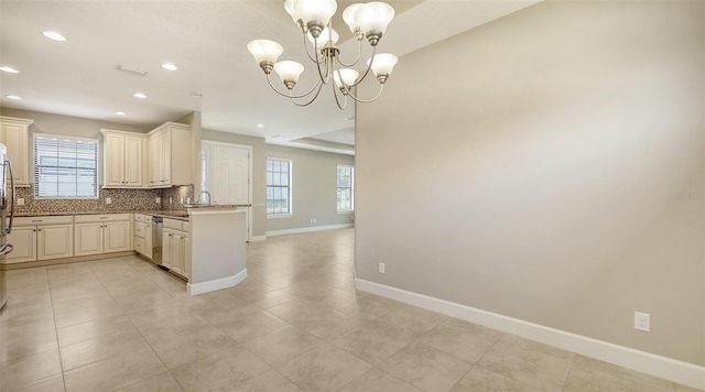 kitchen with backsplash, plenty of natural light, stainless steel dishwasher, baseboards, and recessed lighting