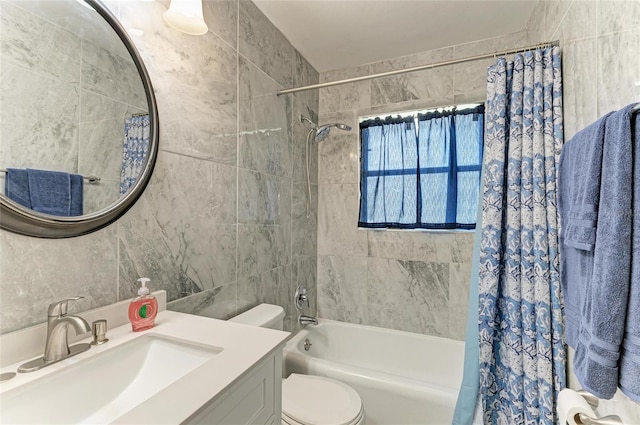 bathroom featuring shower / bathtub combination with curtain, toilet, tile walls, and vanity