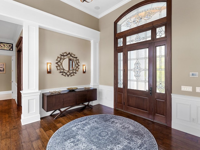 5132 Jungle Plum Rd, Sarasota, FL 34242 - foyer with ornate columns, wood-type flooring, a wainscoted wall, and crown molding