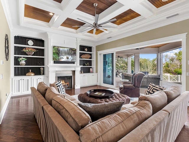 5132 Jungle Plum Rd, Sarasota, FL 34242 - living room with a ceiling fan, ornamental molding, coffered ceiling, beam ceiling, and a warm lit fireplace