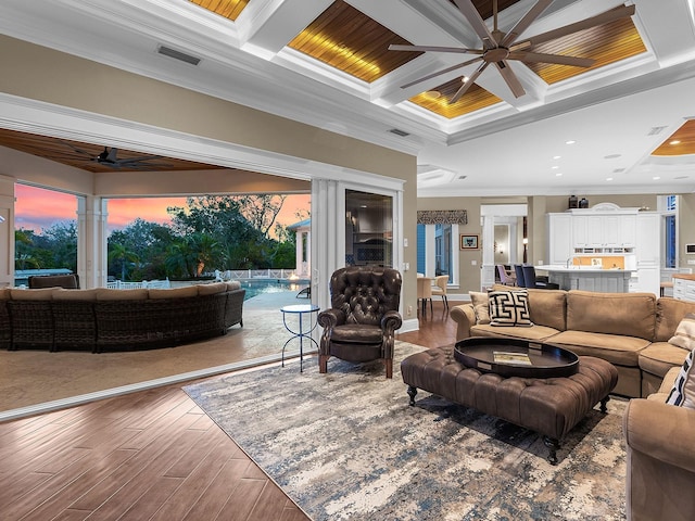 5132 Jungle Plum Rd, Sarasota, FL 34242 - living room featuring ceiling fan, coffered ceiling, crown molding, wood finished floors, and beam ceiling