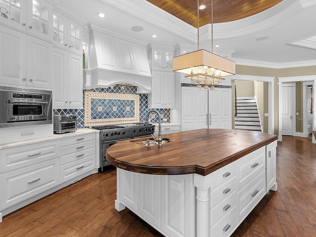 5132 Jungle Plum Rd, Sarasota, FL 34242 - kitchen featuring wooden counters, double oven range, a sink, dark wood-style floors, and premium range hood