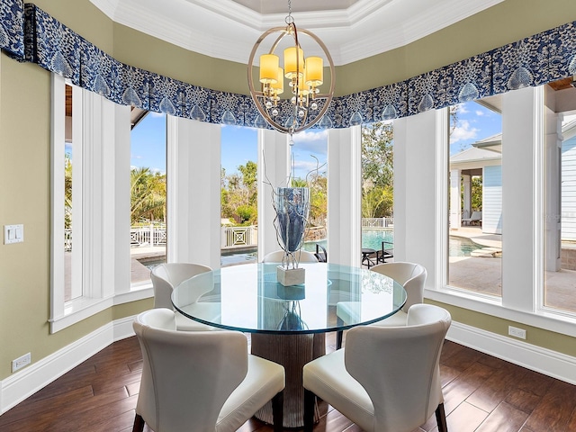 5132 Jungle Plum Rd, Sarasota, FL 34242 - dining room with a chandelier, hardwood / wood-style floors, crown molding, and baseboards