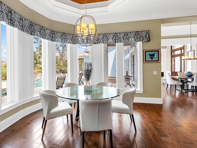 5132 Jungle Plum Rd, Sarasota, FL 34242 - dining room with a chandelier, ornamental molding, healthy amount of natural light, baseboards, and dark wood-style floors