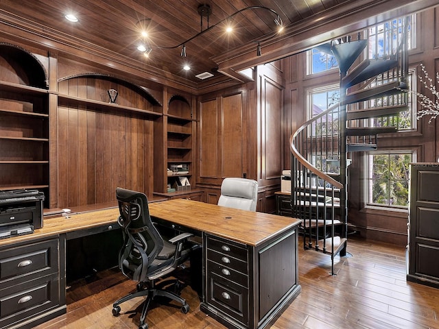5132 Jungle Plum Rd, Sarasota, FL 34242 - home office featuring wooden ceiling, built in shelves, wood walls, built in study area, and light wood-style floors
