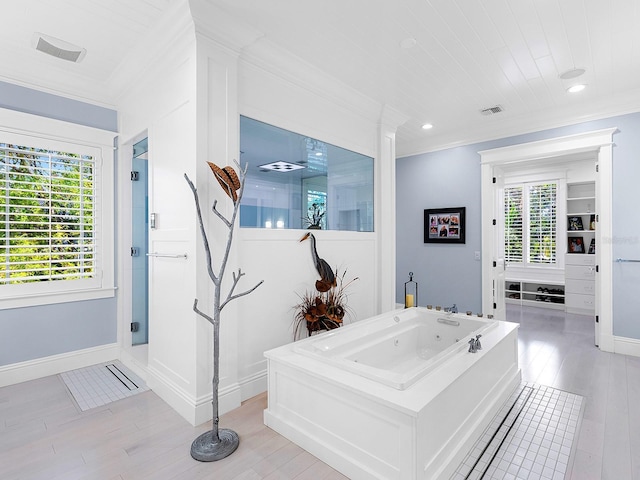 5132 Jungle Plum Rd, Sarasota, FL 34242 - bathroom featuring ornamental molding, wood finished floors, a whirlpool tub, baseboards, and recessed lighting