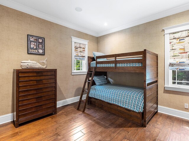 5132 Jungle Plum Rd, Sarasota, FL 34242 - bedroom featuring hardwood / wood-style flooring, baseboards, and crown molding