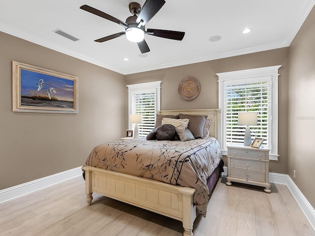 5132 Jungle Plum Rd, Sarasota, FL 34242 - bedroom featuring light wood finished floors, multiple windows, crown molding, baseboards, and ceiling fan