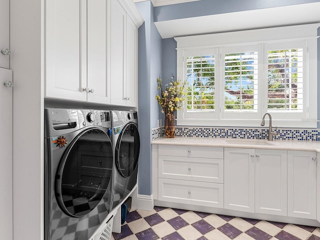 5132 Jungle Plum Rd, Sarasota, FL 34242 - laundry room featuring cabinet space, separate washer and dryer, and light flooring
