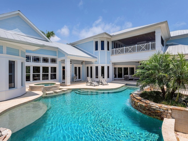 5132 Jungle Plum Rd, Sarasota, FL 34242 - view of pool featuring a pool with connected hot tub, a patio, french doors, and a ceiling fan