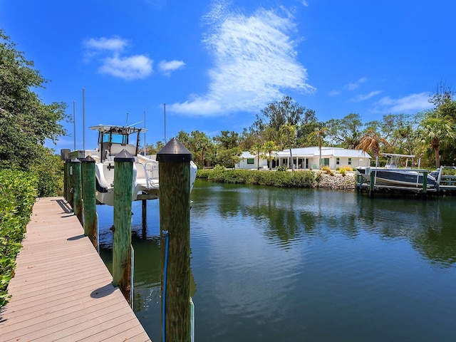 5132 Jungle Plum Rd, Sarasota, FL 34242 - dock featuring boat lift and a water view