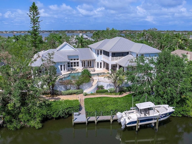 5132 Jungle Plum Rd, Sarasota, FL 34242 - back of house with an outdoor pool, a balcony, and a water view