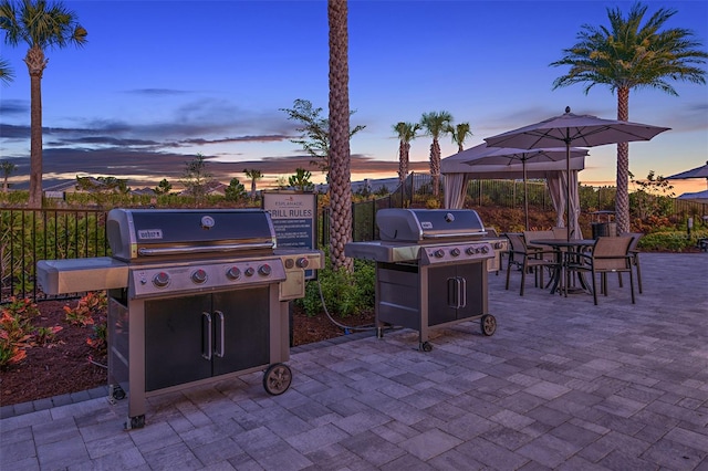 view of patio / terrace with outdoor dining area, fence, and grilling area