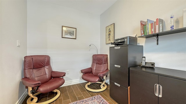 235 Cocoanut Ave Unit 108B, Sarasota, FL 34236 - sitting room featuring baseboards and wood finished floors
