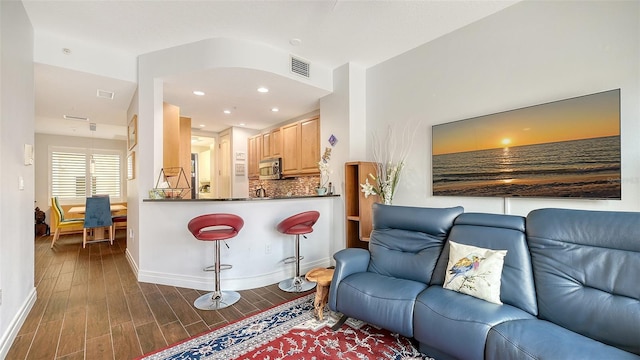 235 Cocoanut Ave Unit 108B, Sarasota, FL 34236 - living area featuring baseboards, dark wood-style floors, and recessed lighting