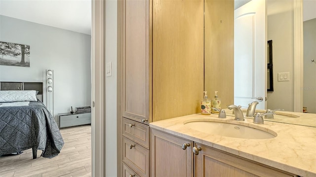 235 Cocoanut Ave Unit 108B, Sarasota, FL 34236 - bathroom featuring ensuite bathroom, wood finished floors, and vanity