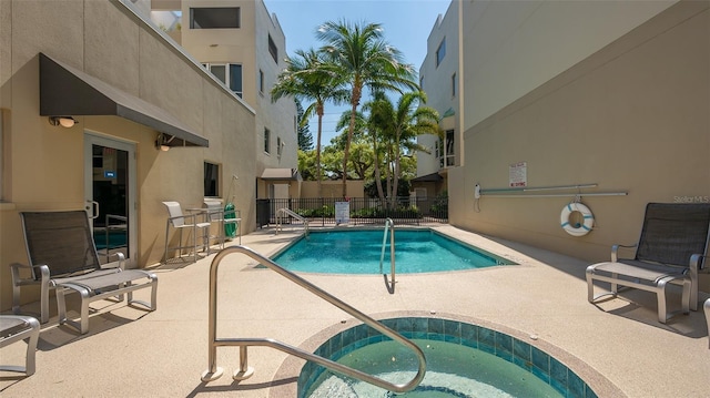 235 Cocoanut Ave Unit 108B, Sarasota, FL 34236 - community pool with a patio, fence, and a community hot tub