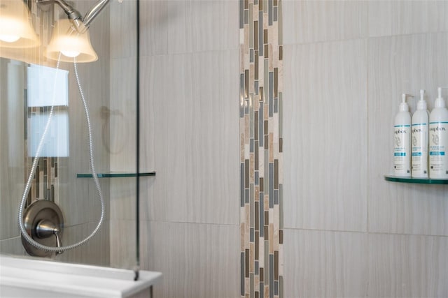 full bathroom with tiled shower