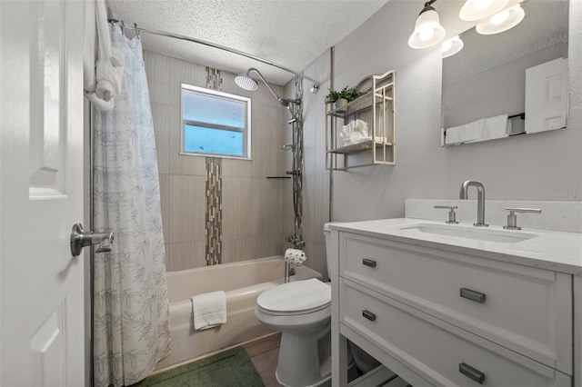 bathroom with toilet, shower / bath combination with curtain, wood finished floors, vanity, and a textured ceiling
