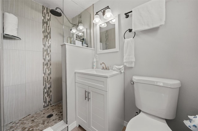 full bathroom with walk in shower, toilet, and vanity