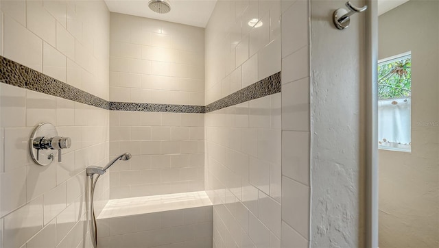 full bathroom featuring tiled shower