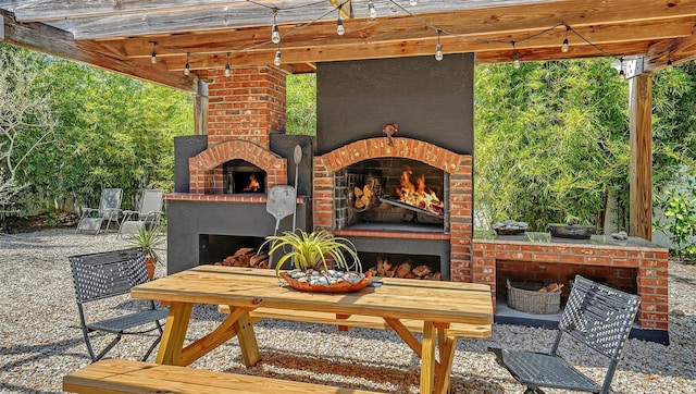 view of patio featuring an outdoor fireplace