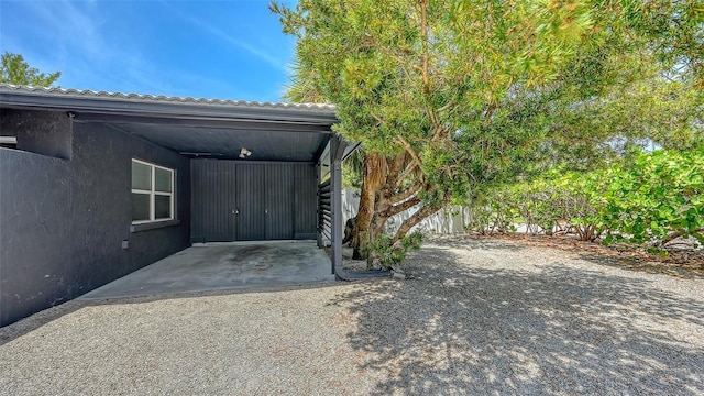 garage featuring a carport
