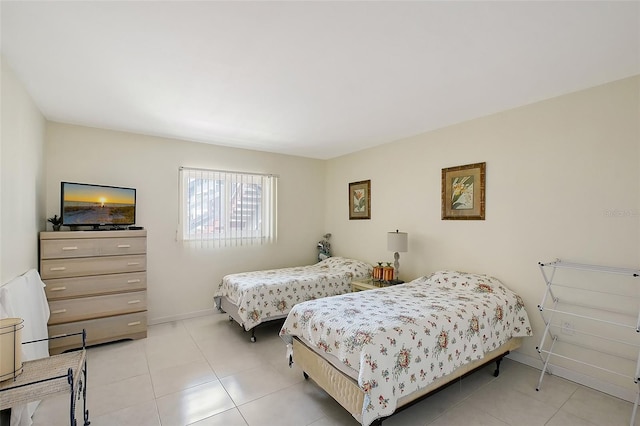3705 S School Ave Unit 3, Sarasota, FL 34239 - bedroom featuring light tile patterned floors and baseboards