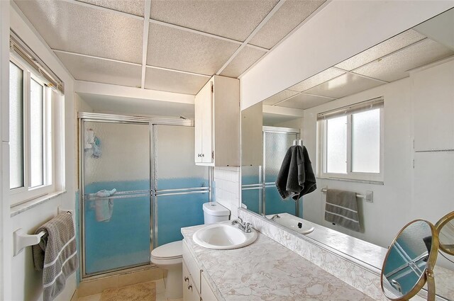 3705 S School Ave Unit 3, Sarasota, FL 34239 - full bathroom featuring a shower stall, toilet, vanity, and tile patterned flooring