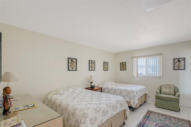 3705 S School Ave Unit 3, Sarasota, FL 34239 - bedroom with light tile patterned floors and baseboards