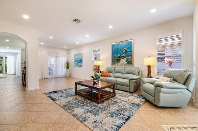 20040 Rookery Dr, Estero, FL 33928 - living room featuring arched walkways, light tile patterned floors, plenty of natural light, and recessed lighting