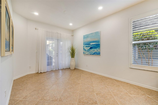 20040 Rookery Dr, Estero, FL 33928 - unfurnished room with healthy amount of natural light, recessed lighting, baseboards, and light tile patterned floors