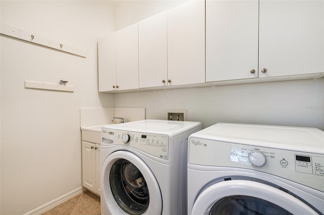 20040 Rookery Dr, Estero, FL 33928 - clothes washing area with washer and clothes dryer, cabinet space, baseboards, and light tile patterned flooring