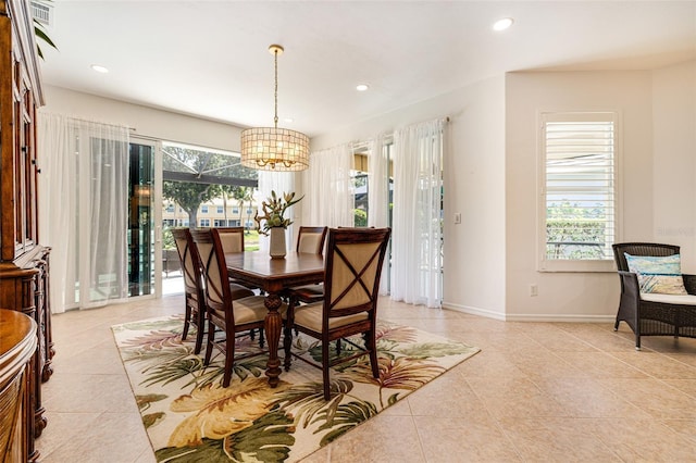 20040 Rookery Dr, Estero, FL 33928 - dining space featuring a chandelier, healthy amount of natural light, light tile patterned flooring, baseboards, and recessed lighting