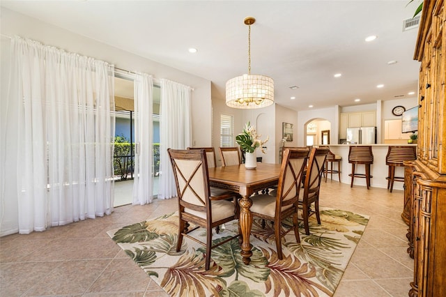 20040 Rookery Dr, Estero, FL 33928 - dining room with light tile patterned floors, arched walkways, a chandelier, and recessed lighting