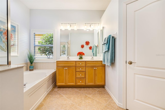 20040 Rookery Dr, Estero, FL 33928 - full bathroom featuring tile patterned flooring, double vanity, and a garden tub
