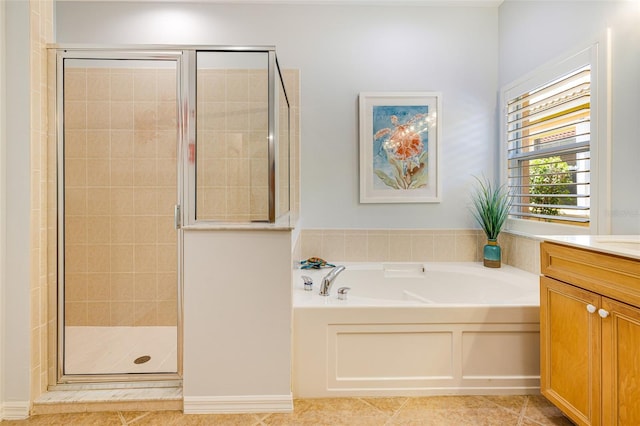 20040 Rookery Dr, Estero, FL 33928 - full bathroom with a garden tub, a stall shower, vanity, and tile patterned flooring