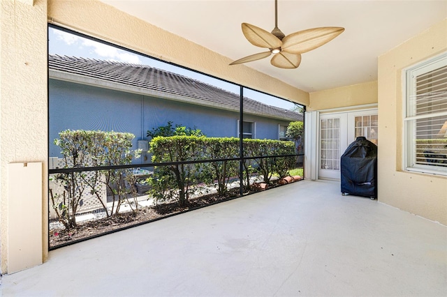 20040 Rookery Dr, Estero, FL 33928 - unfurnished sunroom featuring ceiling fan, concrete flooring, and a textured wall