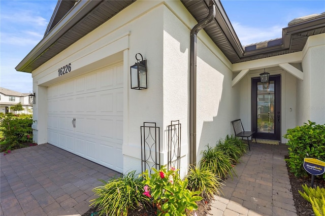 16226 Hidden Oak Loop, Bradenton, FL 34211 - garage featuring driveway