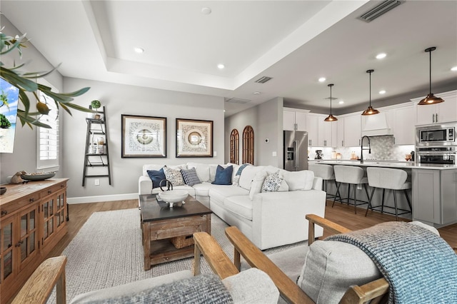16226 Hidden Oak Loop, Bradenton, FL 34211 - living room with light wood-style floors, baseboards, and recessed lighting
