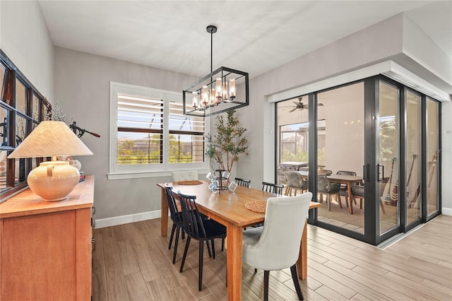 16226 Hidden Oak Loop, Bradenton, FL 34211 - dining space featuring light wood-type flooring, a chandelier, and baseboards