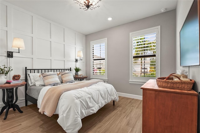 16226 Hidden Oak Loop, Bradenton, FL 34211 - bedroom with light wood-style flooring, baseboards, and recessed lighting